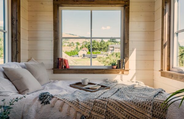 tiny house bedroom with farm outside window