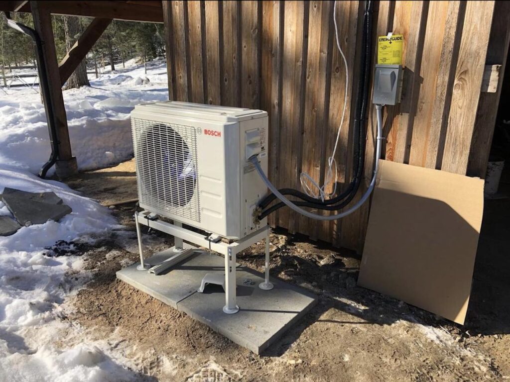 Heat pump unit on stand outside