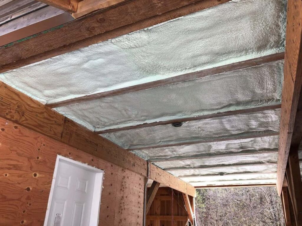White spray foam insulation in a barn ceiling